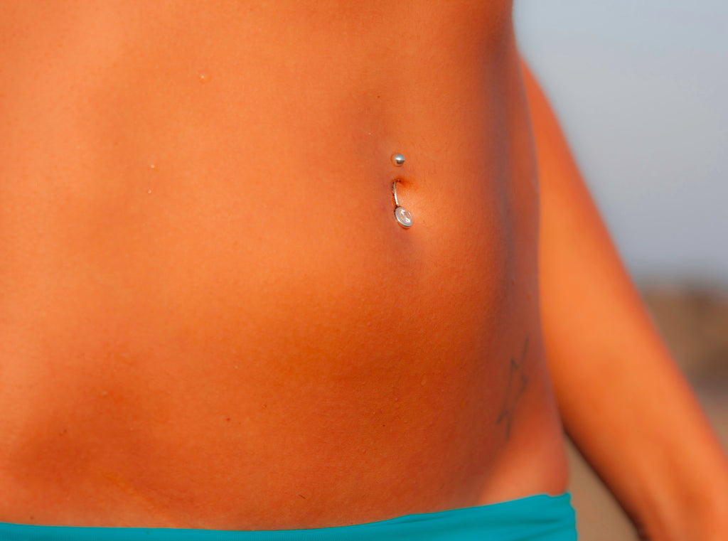 How to Treat Your Infected Belly Button Piercing? - Beadnova